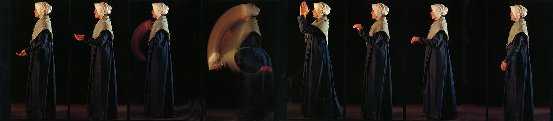 Museum interpreter showing the basic hand movements involved in the canonized version of Shaker dance