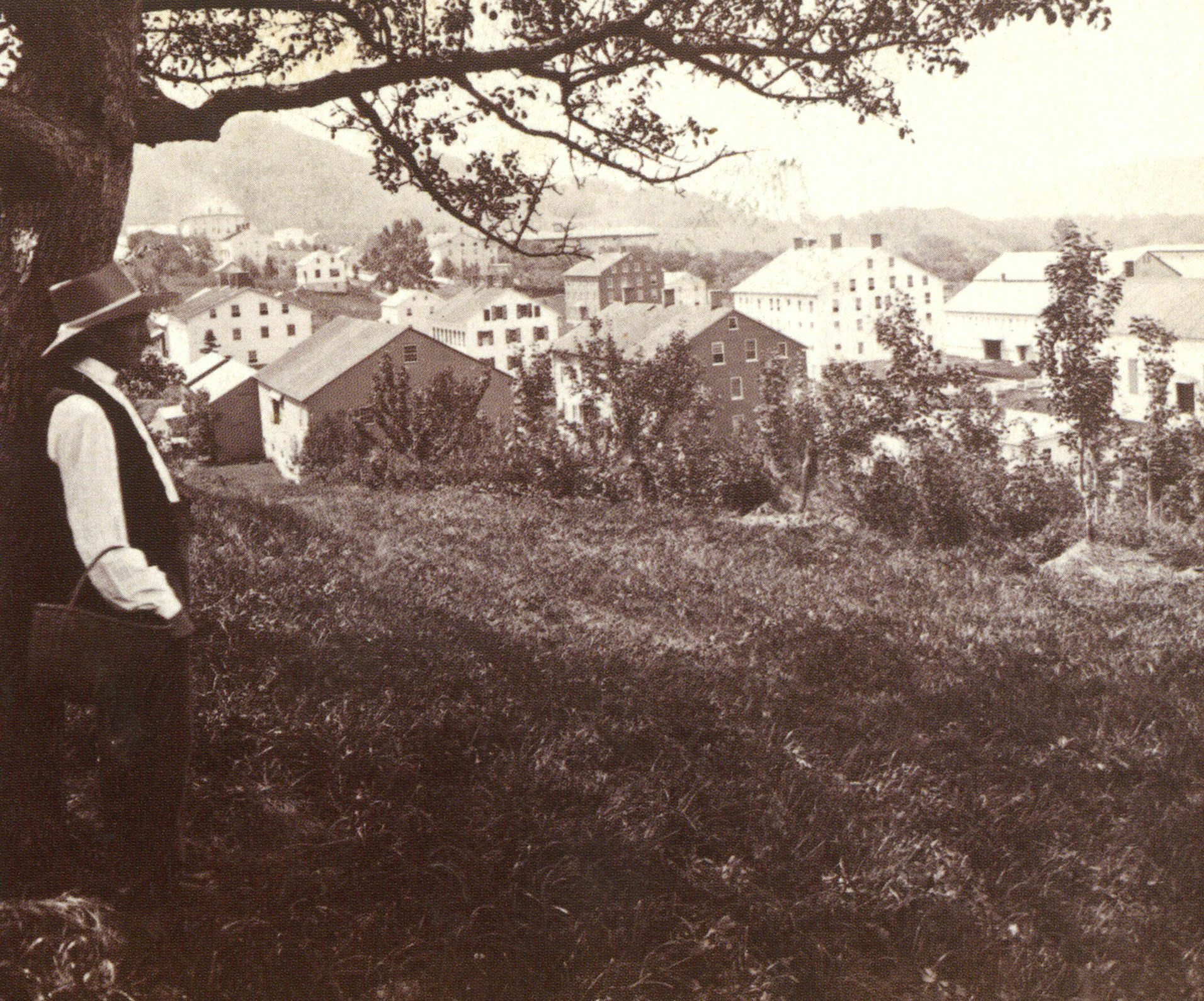 Shakers villages were strict, industrious communities, where all sorts of human behavior was regulated in pursuit of a pure, peaceful and egalitarian way of life. Church Family Elder Daniel Crosman overlooking Mount Lebanon, Oliver B. Buell, c. 1872, Collection of Jerry Grant and Sharon Koomler